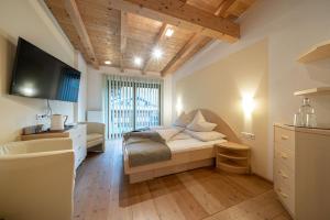 Postel nebo postele na pokoji v ubytování Genusshotel Alpenblick