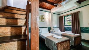Cama ou camas em um quarto em Pousada Monte Azul