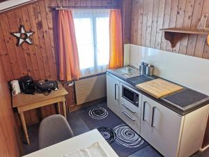 a small kitchen with a stove and a sink at Las aclas in Valbella