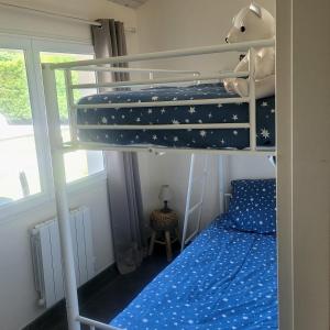 Krevet ili kreveti na kat u jedinici u objektu Maison d'Amis