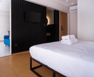 Ein Bett oder Betten in einem Zimmer der Unterkunft PAREA Athens