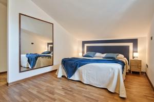 Katil atau katil-katil dalam bilik di 5 MIGLIA APARTMENT la mansarda a Collegno