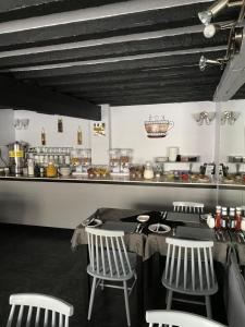 a kitchen with a table and chairs and a counter at Westdene in Skegness