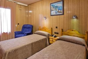Postel nebo postele na pokoji v ubytování Hotel Doña Blanca