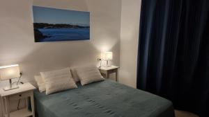 Postel nebo postele na pokoji v ubytování Apartamento familiar con piscina y wifi