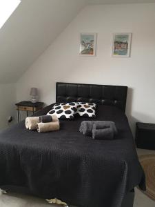Ένα ή περισσότερα κρεβάτια σε δωμάτιο στο Parenthèse Normande à 2 pas de la mer