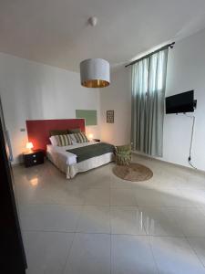 Postel nebo postele na pokoji v ubytování Arcobaleno Home