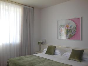 Posteľ alebo postele v izbe v ubytovaní Starhotels Cristallo Palace