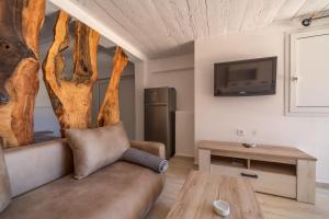 a living room with a couch and a table at Apartman Sara in Bar