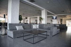 a living room with a couch and a coffee table at Royal Bay Suites in Kefalos