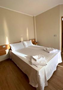 Postel nebo postele na pokoji v ubytování Tékada Hotel & Restaurant
