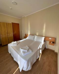 Postel nebo postele na pokoji v ubytování Tékada Hotel & Restaurant
