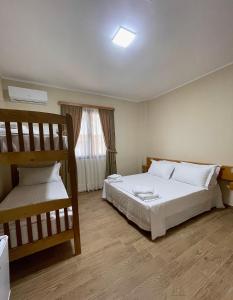 Postel nebo postele na pokoji v ubytování Tékada Hotel & Restaurant