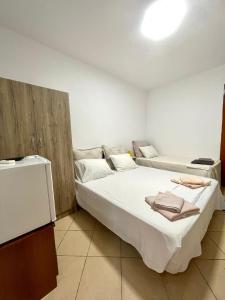 Postel nebo postele na pokoji v ubytování Tékada Hotel & Restaurant