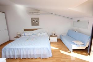 Posteľ alebo postele v izbe v ubytovaní Apartments Dujmović
