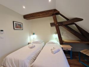 Posteľ alebo postele v izbe v ubytovaní Le Faubourg - Gîte et chambres d'hôte