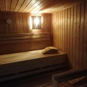 a sauna with a bed with a light in it at Fräulein Clara - Steinhude in Wunstorf