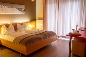 Postel nebo postele na pokoji v ubytování Hotel Auwirt Zentrum