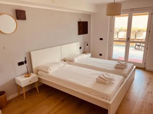 Posteľ alebo postele v izbe v ubytovaní Sunset Feel House