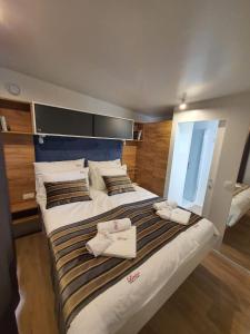 Кровать или кровати в номере Mobile home Linico