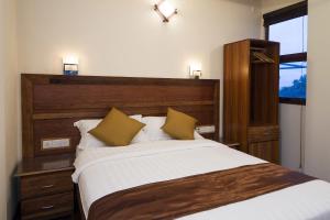 Tropic Tree Maldives客房内的一张或多张床位
