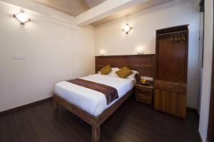 Tropic Tree Maldives客房内的一张或多张床位