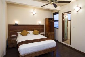 Tropic Tree Maldives客房内的一张或多张床位