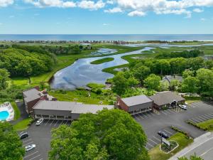 a large body of water with trees and buildings at Ogunquit River Inn & Suites, Ascend Hotel Collection in Ogunquit
