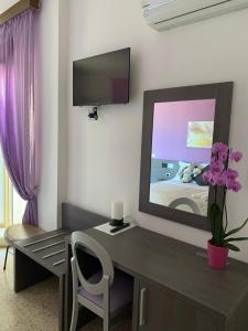 TV a/nebo společenská místnost v ubytování GFH - Hotel Spiaggia D'Oro