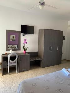 Postel nebo postele na pokoji v ubytování GFH - Hotel Spiaggia D'Oro