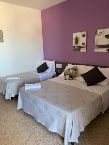 Postel nebo postele na pokoji v ubytování GFH - Hotel Spiaggia D'Oro