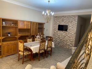 a dining room with a table and some chairs at Don Bosco in Ravanusa