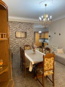 a dining room with a table and a living room at Don Bosco in Ravanusa