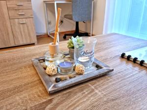 a tray with food and chopsticks on a table at BRISE Business Apartment nahe Leipziger Messe - Porsche - BMW - DHL - WLAN - Parkplatz - business travelers only in Leipzig