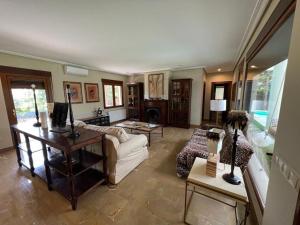 a living room with a couch and a table at Villa Ca Toni in Alicante