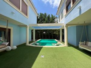 a swimming pool in the backyard of a house at Villa Ca Toni in Alicante