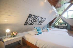 Letto o letti in una camera di Evergreen Pakchong Home