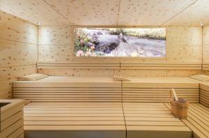 a sauna with a tv on top of it at Hotel Venter Bergwelt in Vent