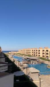 a resort with a marina with boats in the water at Cozy Chalet in El Ain El Sokhna شالية بالعين السخنة in Ain Sokhna