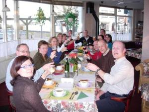 a group of people sitting at a dinner table at Hotel Brinkzicht in De Koog