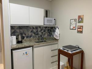 Køkken eller tekøkken på Apart. Acolhedor na Praia de Itapuã