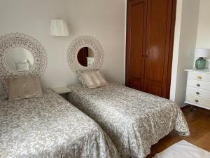 Postel nebo postele na pokoji v ubytování Apartamento Amura en Playa de Las Cucharas