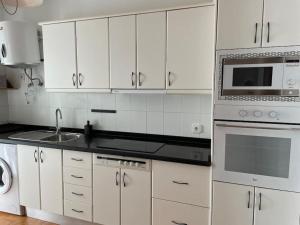 Kuchyň nebo kuchyňský kout v ubytování Apartamento Amura en Playa de Las Cucharas