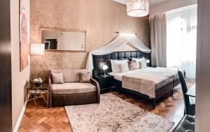 Posteľ alebo postele v izbe v ubytovaní Alfons Boutique Hotel