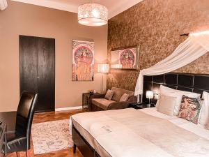 Posteľ alebo postele v izbe v ubytovaní Alfons Boutique Hotel
