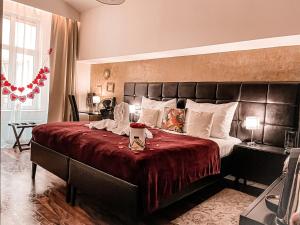 Posteľ alebo postele v izbe v ubytovaní Alfons Boutique Hotel