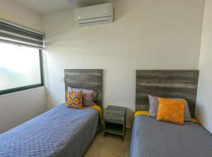 מיטה או מיטות בחדר ב-Casa con alberca, coto privado, gran ubicacíon