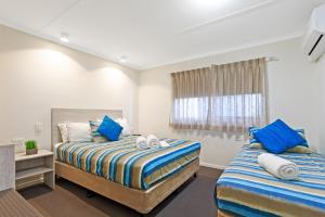 Postel nebo postele na pokoji v ubytování Top Spot Motel