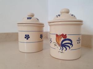 two cups sitting next to each other on a counter at La Noscia - Le Dimore di Thesia in Otranto