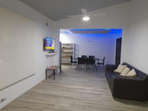 a living room with a couch and a table at CASA CONFORTABLE II in Córdoba